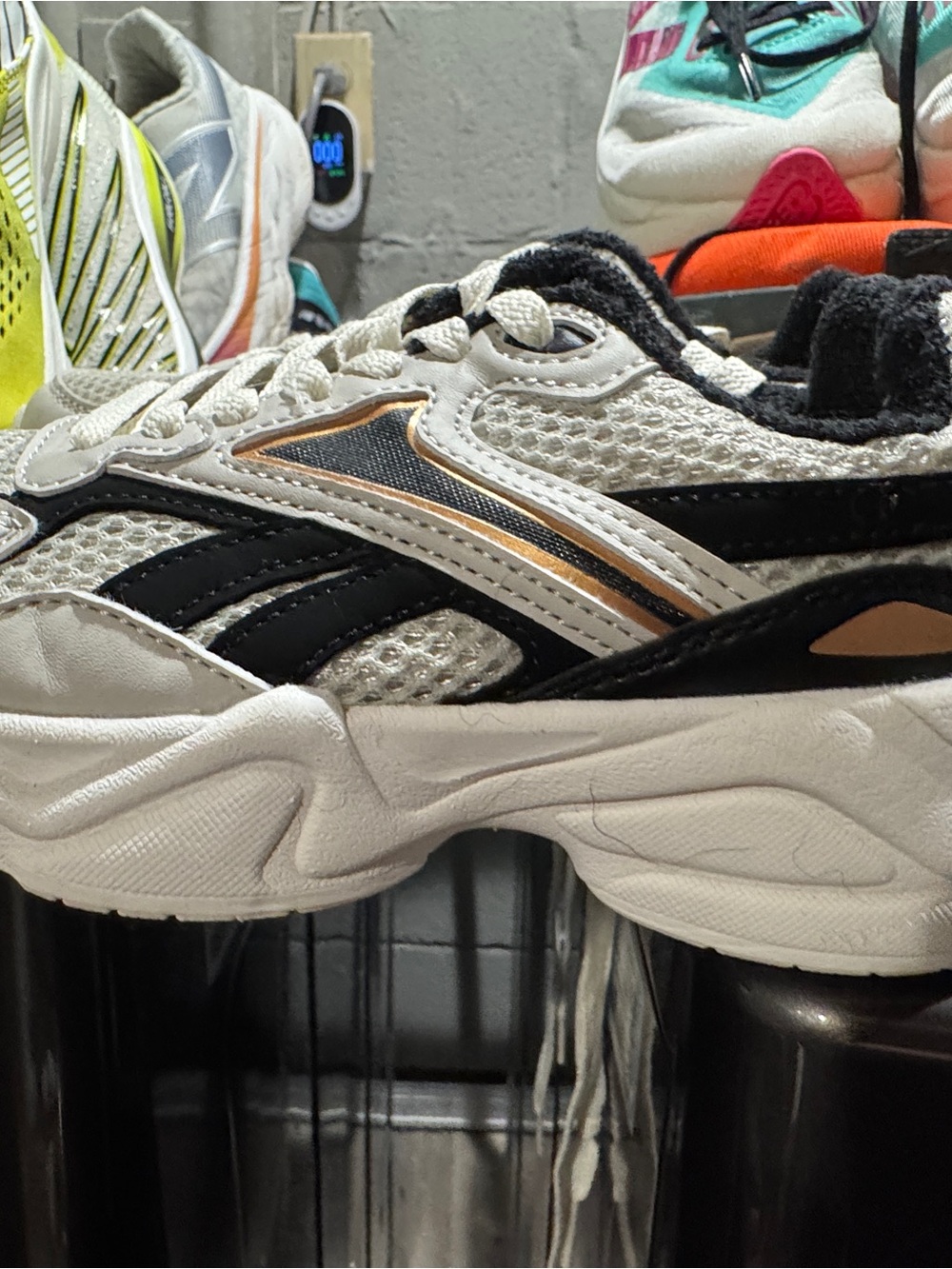 Reebok White Black Athletic Sneakers with Metallic Bronze Accent